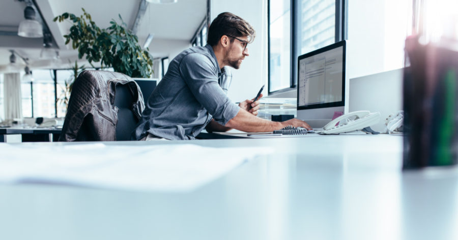 Businessman looking at computer monitor